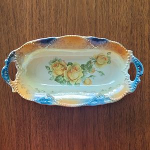 VINTAGE GERMANY OVAL DISH IN GOLDS AND BLUES. HAND PAINTED ARTIST NAME / FLOWER.